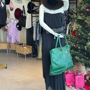 Elegant Black Strapless Dress with Green Tote